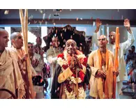 Devotees Throw Flower Petals at Srila Prabhupada in Temple