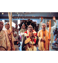 Devotees Throw Flower Petals at Srila Prabhupada in Temple