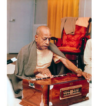 Srila Prabhupada Playing Harmonium